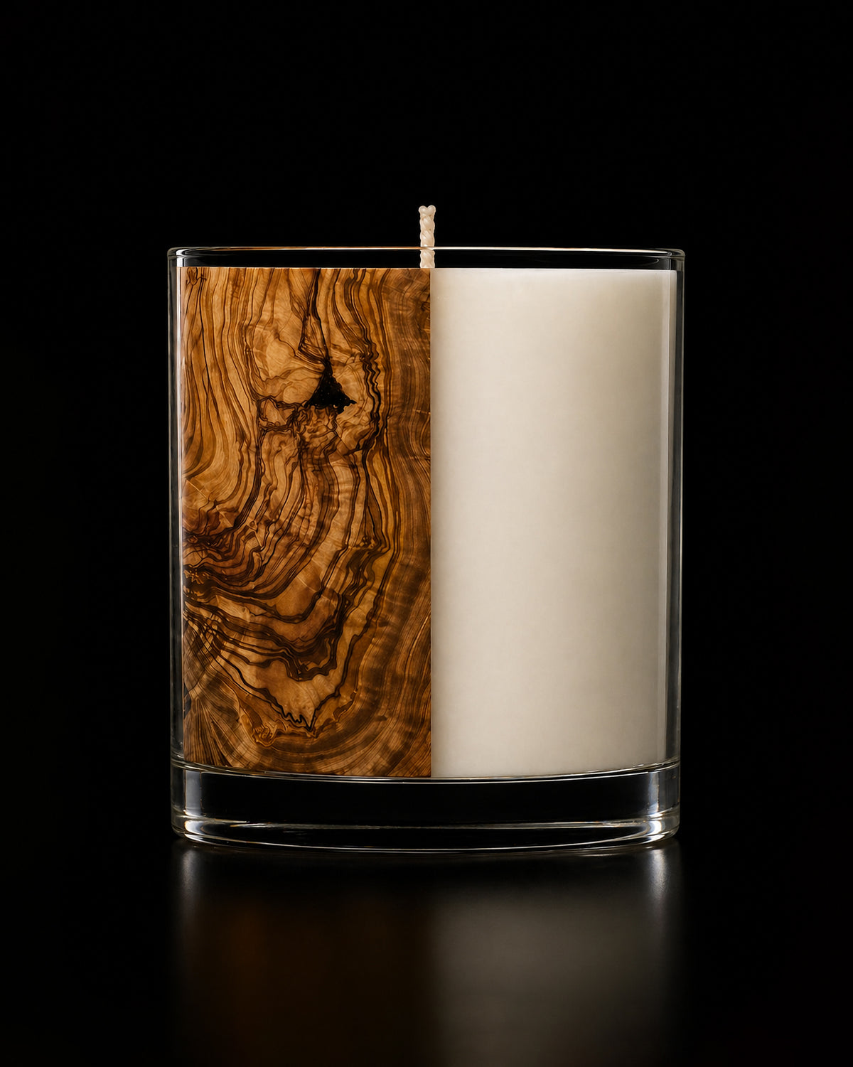 Premium home fragrance candle with olive wood, tea leaves, and patchouli creating a serene, nature-inspired ambiance