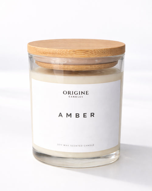 scrnted candle with citrus, aromatic herbs, and creamy vanilla wood notes for a refined and soothing ambiance