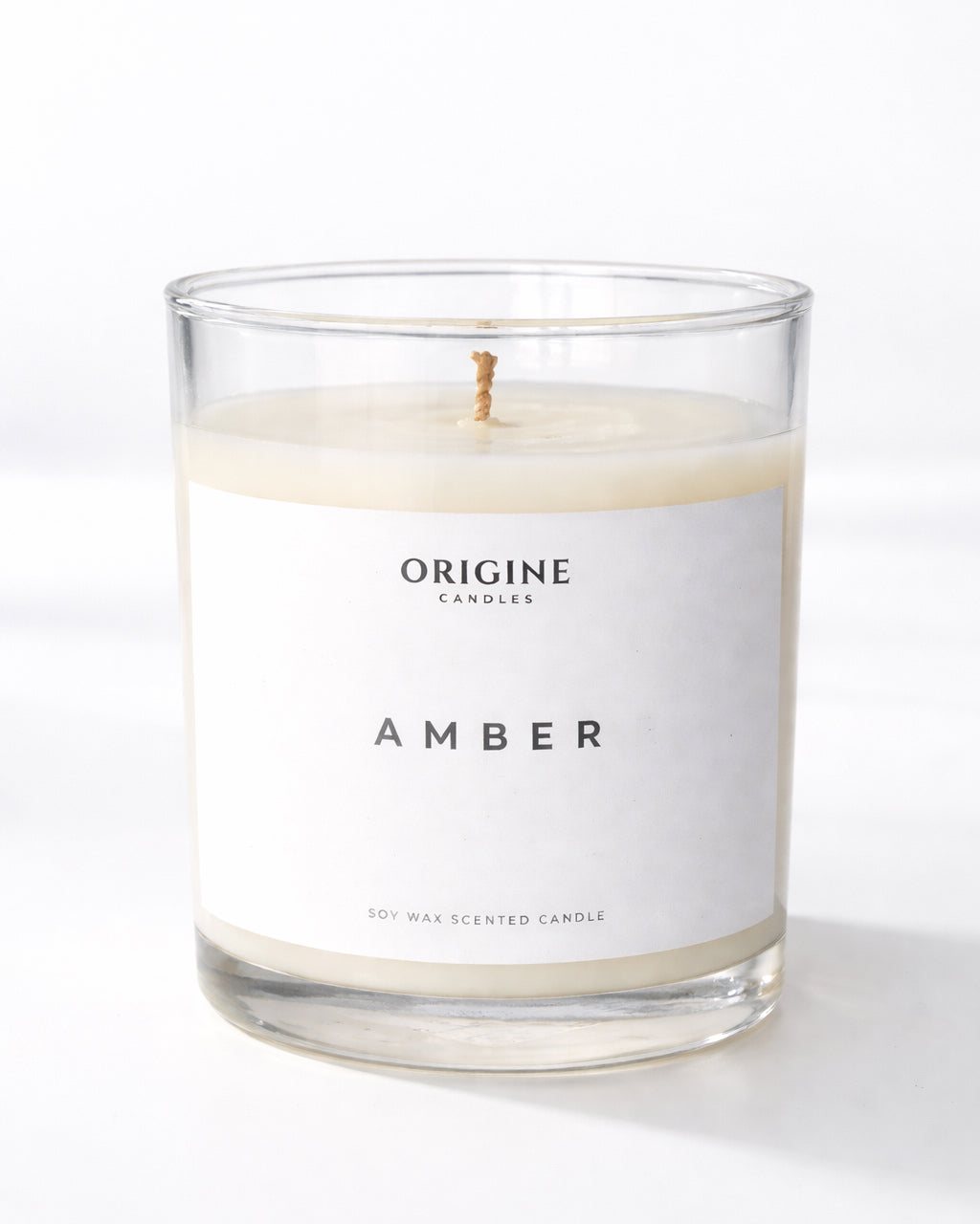 scented candle with soft florals, and warm vanilla amber creating an elegant and comforting atmosphere