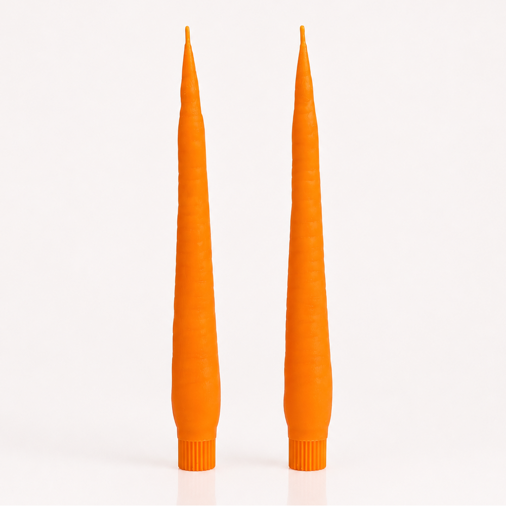 Two tall, CARROT candles on a white background