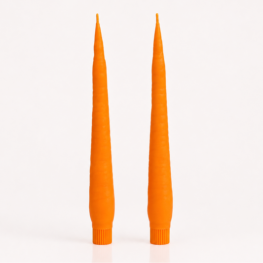 Two tall, CARROT candles on a white background