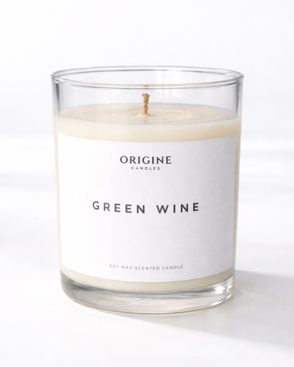 scented candle with fresh grape, quince, and warm honey notes creating a bright and comforting atmosphere